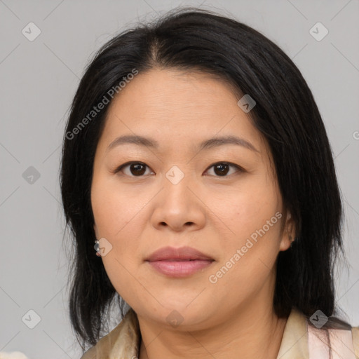 Joyful asian adult female with medium  brown hair and brown eyes