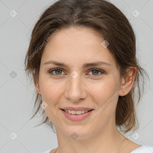 Joyful white young-adult female with medium  brown hair and green eyes