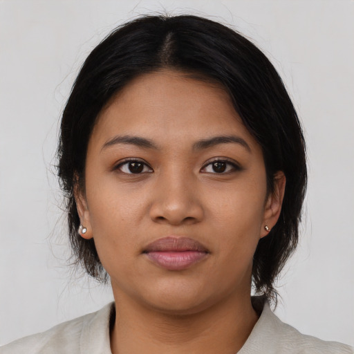 Neutral asian young-adult female with medium  black hair and brown eyes