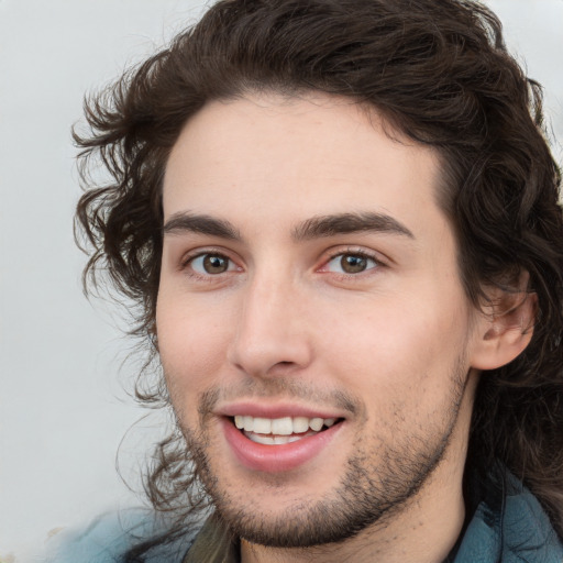 Joyful white young-adult male with medium  brown hair and brown eyes