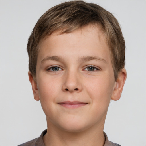 Joyful white child male with short  brown hair and grey eyes