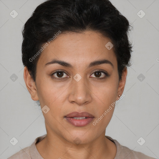 Joyful latino young-adult female with short  brown hair and brown eyes