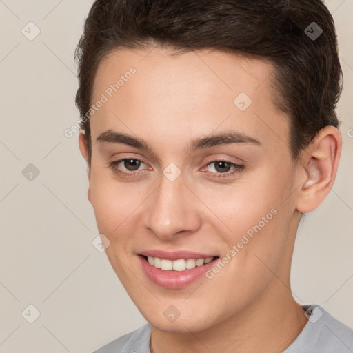 Joyful white young-adult female with short  brown hair and brown eyes