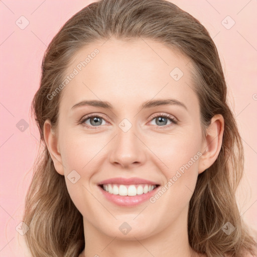 Joyful white young-adult female with medium  brown hair and blue eyes