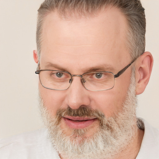 Joyful white middle-aged male with short  brown hair and brown eyes