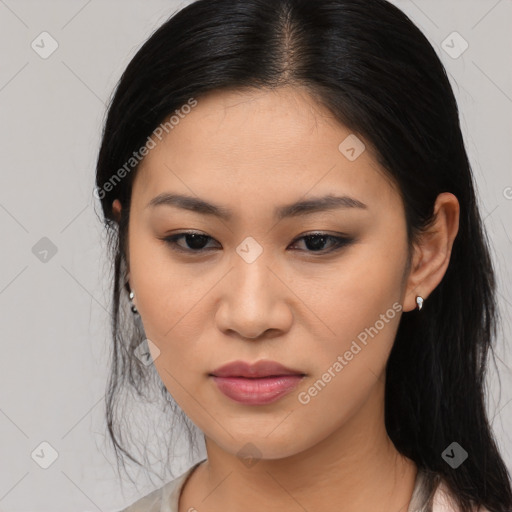 Joyful asian young-adult female with medium  black hair and brown eyes