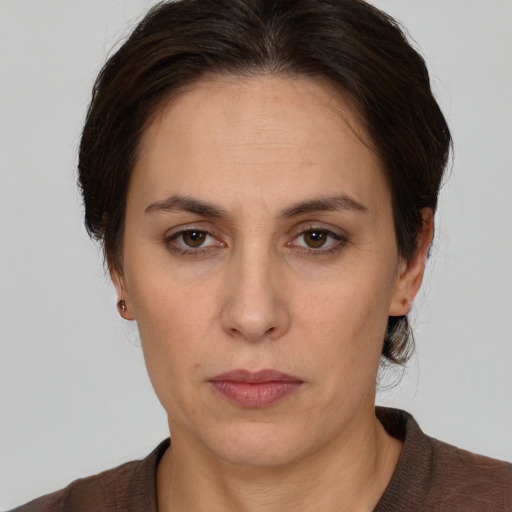 Neutral white adult female with medium  brown hair and brown eyes