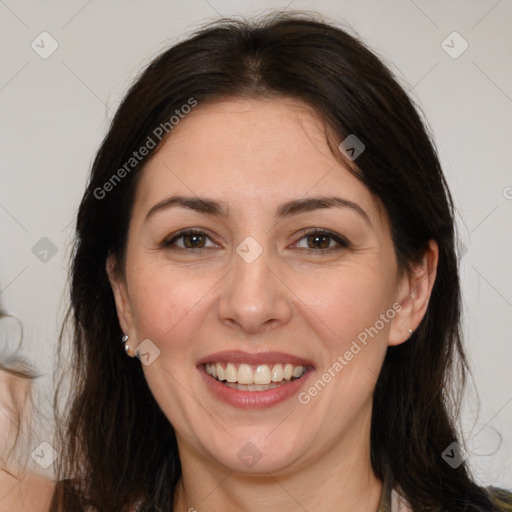 Joyful white adult female with medium  brown hair and brown eyes