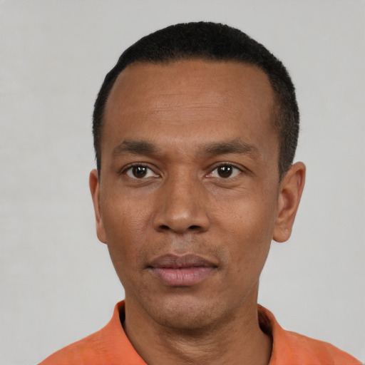 Neutral black young-adult male with short  black hair and brown eyes