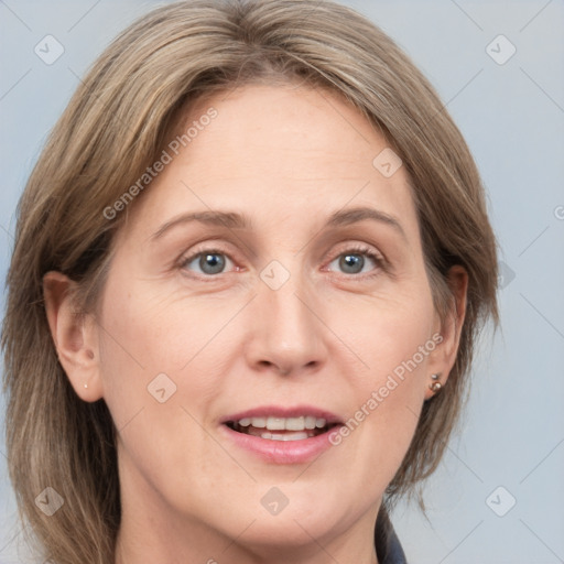 Joyful white adult female with medium  brown hair and grey eyes