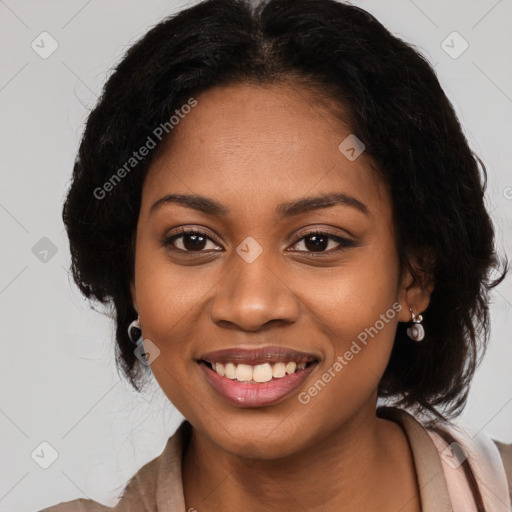 Joyful black young-adult female with long  black hair and brown eyes