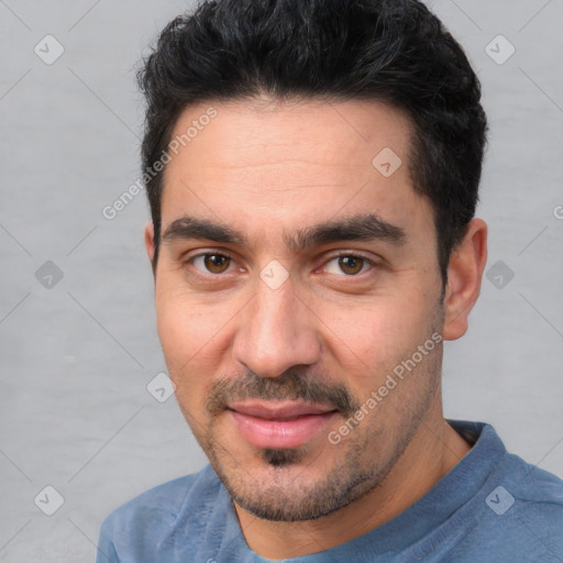 Joyful white young-adult male with short  black hair and brown eyes