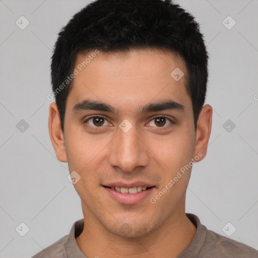 Joyful white young-adult male with short  black hair and brown eyes