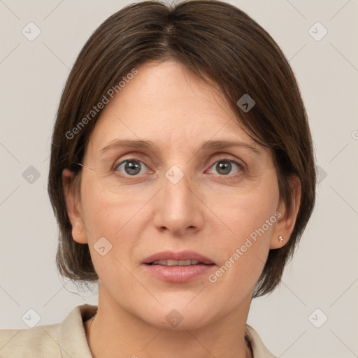 Joyful white adult female with medium  brown hair and grey eyes