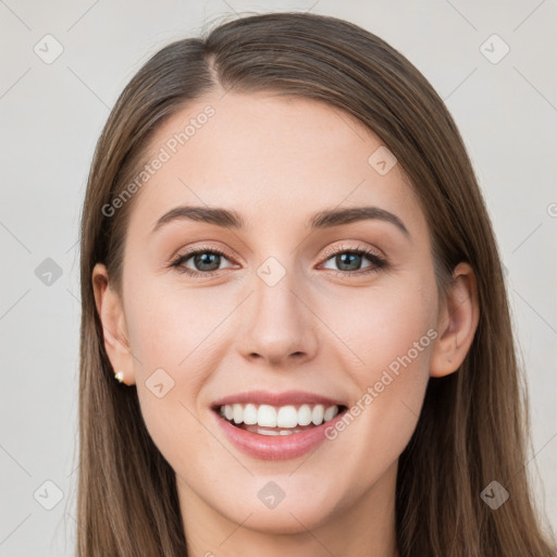 Joyful white young-adult female with long  brown hair and grey eyes