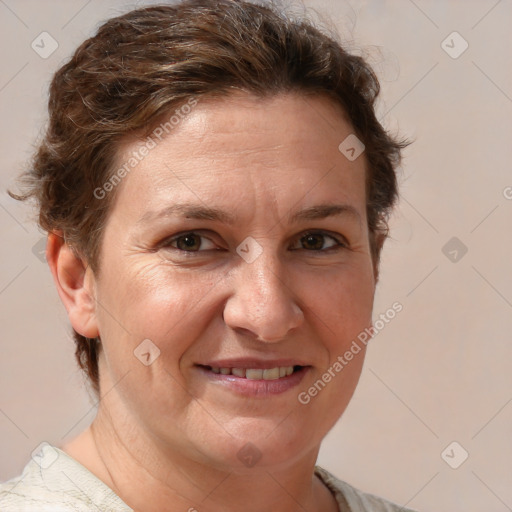 Joyful white adult female with short  brown hair and grey eyes