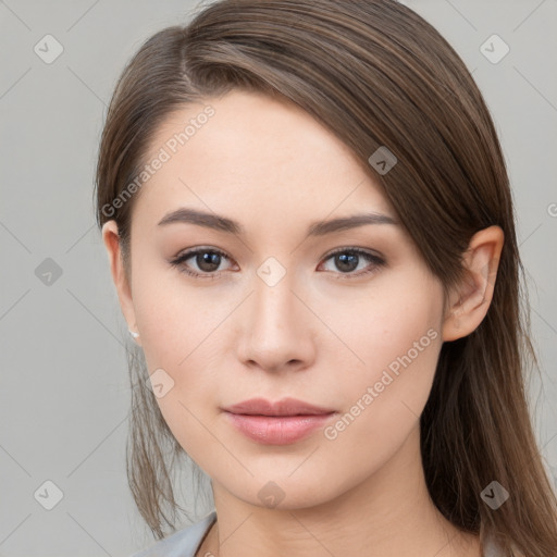 Neutral white young-adult female with long  brown hair and brown eyes