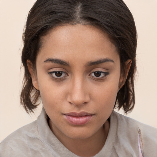 Neutral white young-adult female with medium  brown hair and brown eyes