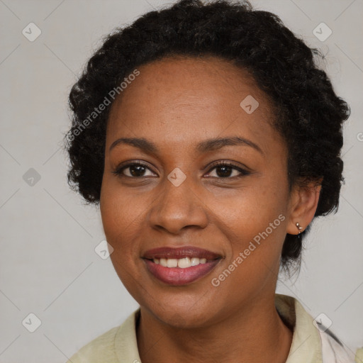 Joyful black adult female with short  brown hair and brown eyes