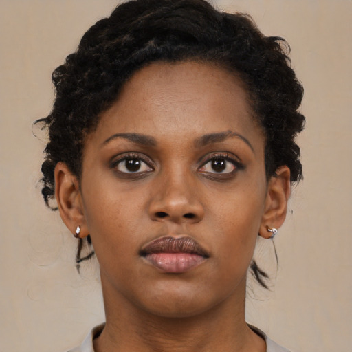 Neutral black young-adult female with short  brown hair and brown eyes
