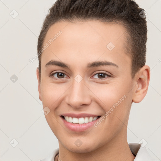 Joyful white young-adult female with short  brown hair and brown eyes