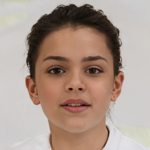 Joyful white child female with short  brown hair and brown eyes