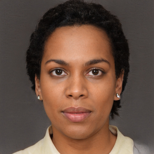Neutral black young-adult female with short  black hair and brown eyes