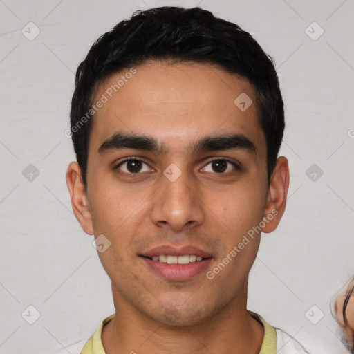 Joyful white young-adult male with short  black hair and brown eyes