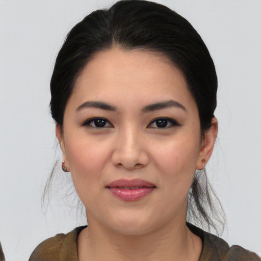 Joyful asian young-adult female with medium  black hair and brown eyes