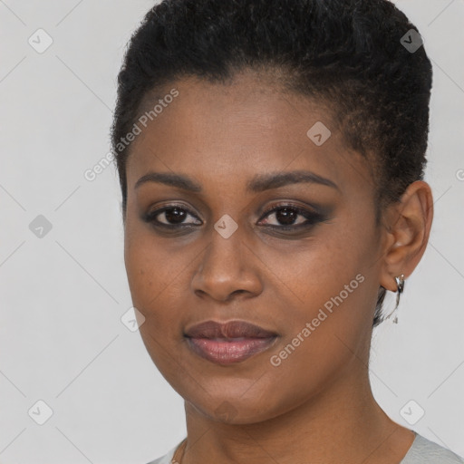 Joyful black young-adult female with short  brown hair and brown eyes