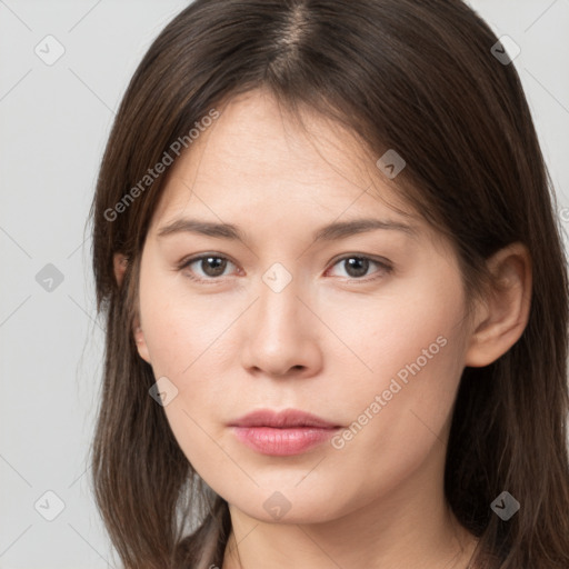 Neutral white young-adult female with long  brown hair and brown eyes