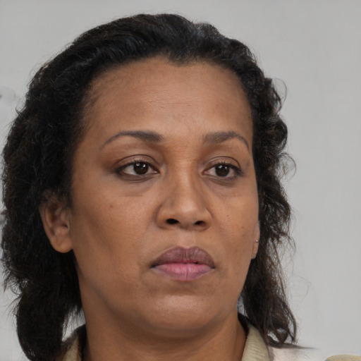 Neutral latino adult female with medium  brown hair and brown eyes