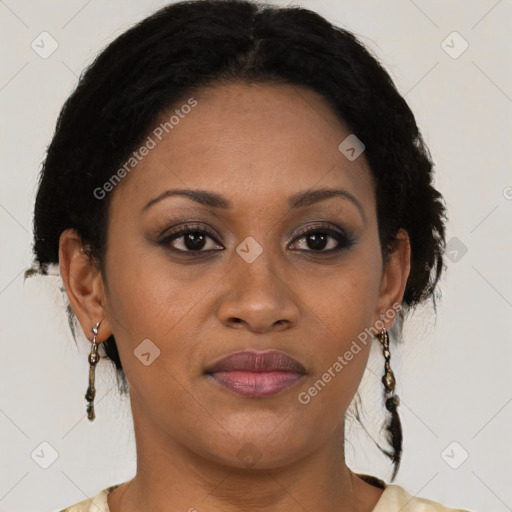 Joyful black adult female with medium  brown hair and brown eyes