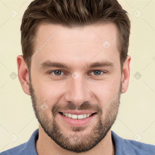 Joyful white young-adult male with short  brown hair and grey eyes