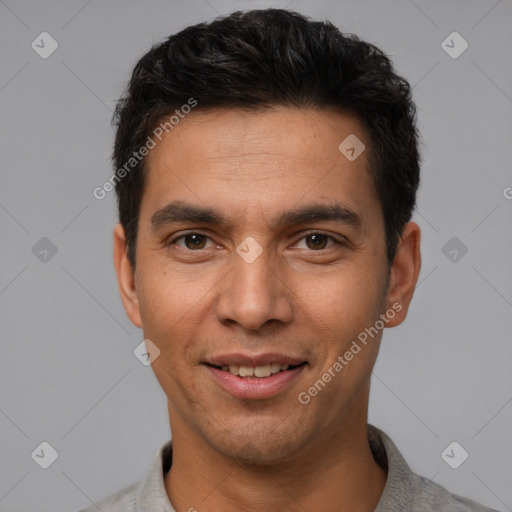 Joyful white young-adult male with short  black hair and brown eyes