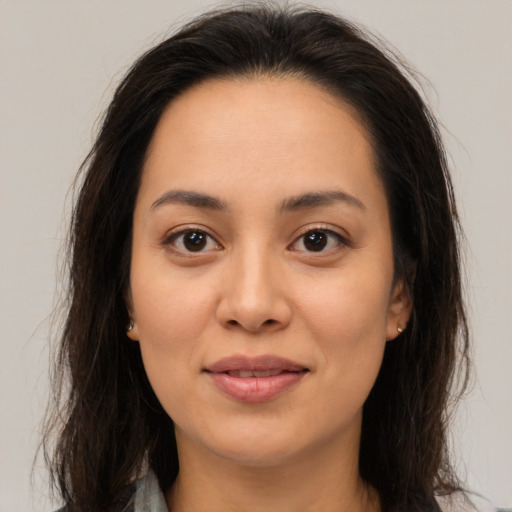 Joyful asian young-adult female with medium  brown hair and brown eyes