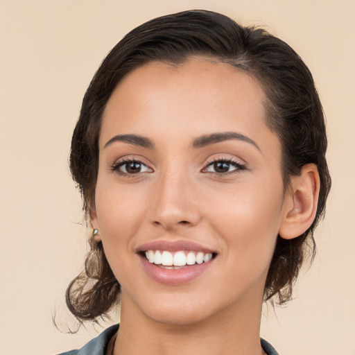 Joyful white young-adult female with medium  brown hair and brown eyes