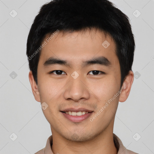 Joyful asian young-adult male with short  black hair and brown eyes