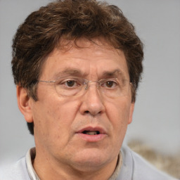 Neutral white middle-aged male with short  brown hair and brown eyes