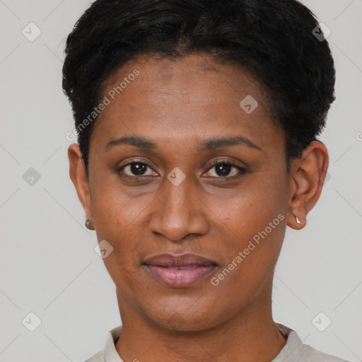Joyful black young-adult female with short  black hair and brown eyes