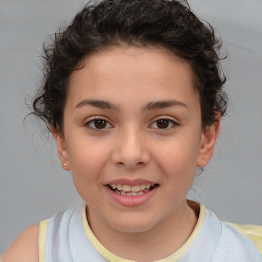 Joyful white child female with short  brown hair and brown eyes