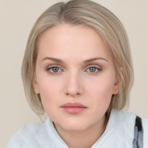 Neutral white young-adult female with medium  brown hair and blue eyes