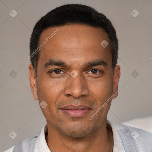 Joyful white adult male with short  black hair and brown eyes