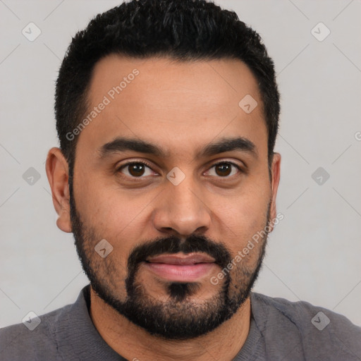 Joyful latino young-adult male with short  black hair and brown eyes