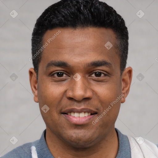 Joyful latino young-adult male with short  black hair and brown eyes