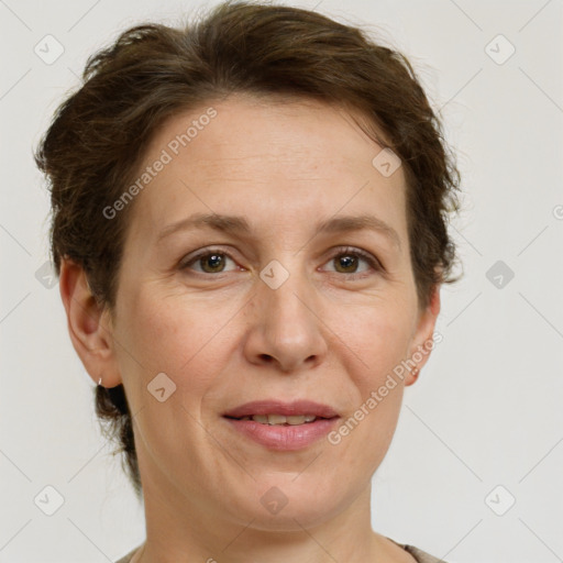 Joyful white adult female with short  brown hair and grey eyes