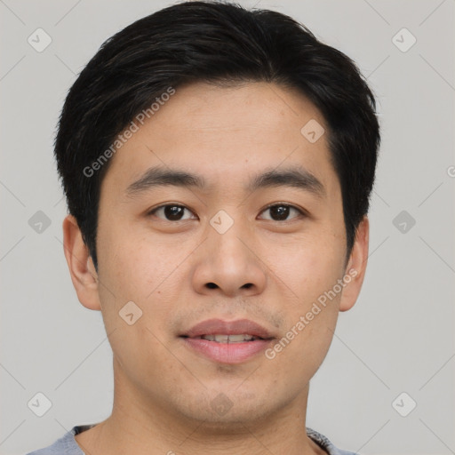 Joyful asian young-adult male with short  black hair and brown eyes