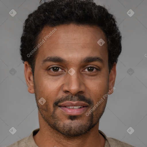 Joyful latino young-adult male with short  brown hair and brown eyes