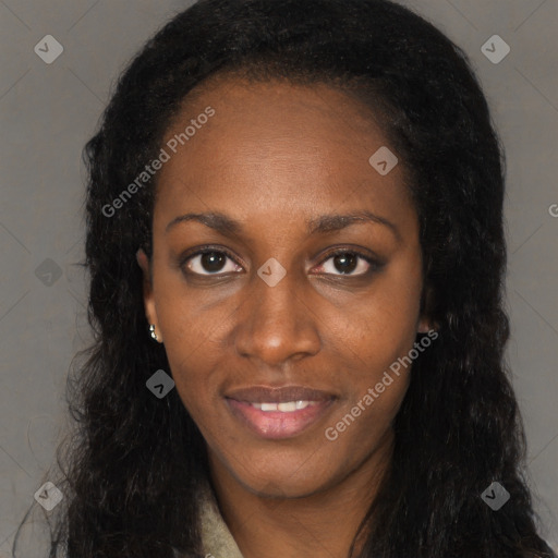 Joyful black young-adult female with long  black hair and brown eyes