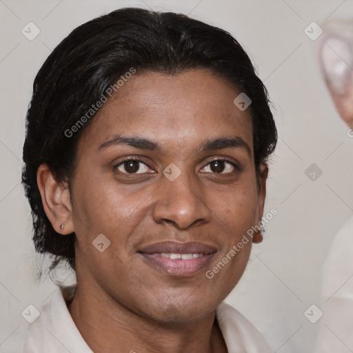 Joyful black young-adult female with short  brown hair and brown eyes